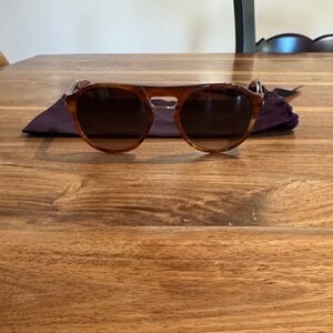 Prada Brown Round Sunglasses with silver trim